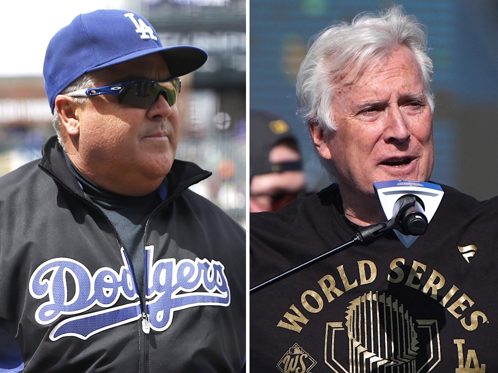 On the left, a middle-aged man with grey hair and sunglasses, wearing a Dodgers cap and jacket. On the right, a white-haired man wearing a World Series shirt speaks into a microphone.