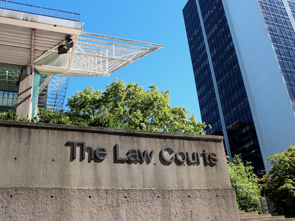 A concrete building built in the 1980s in downtown Vancouver, with the words &lsquo;The Law Courts.&rsquo;