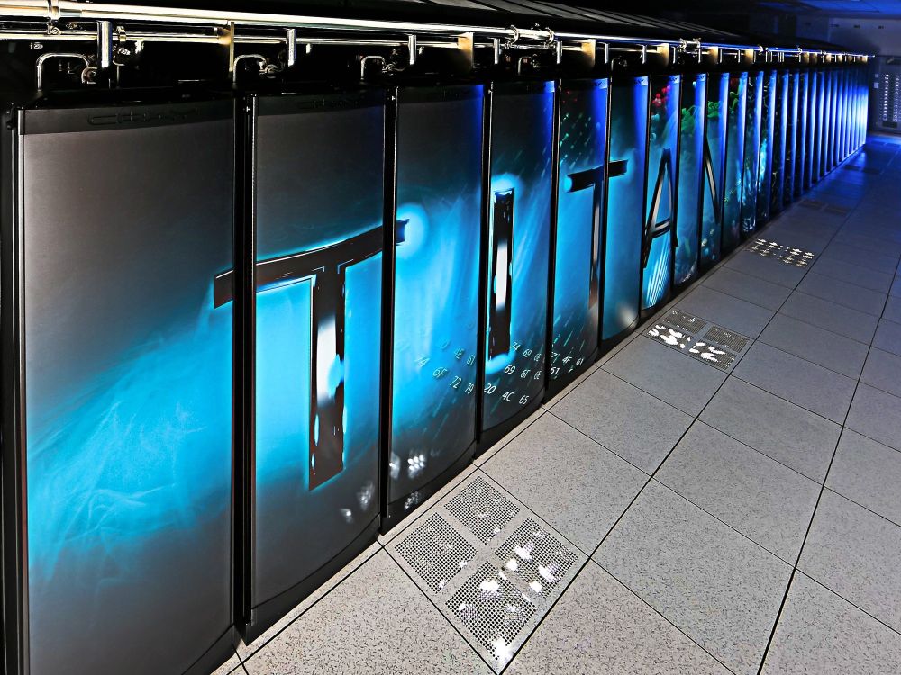 A row of computers stands in an empty corridor.
