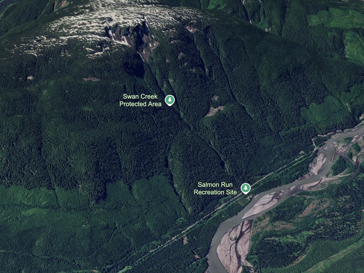 A Google Earth screenshot shows the Swan Creek Protected Area on a slope next to a river.