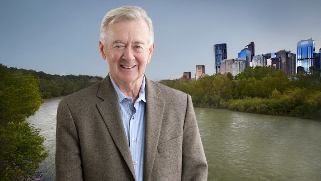 An 89-ish light-skinned man with grey hair smiles for the camera.