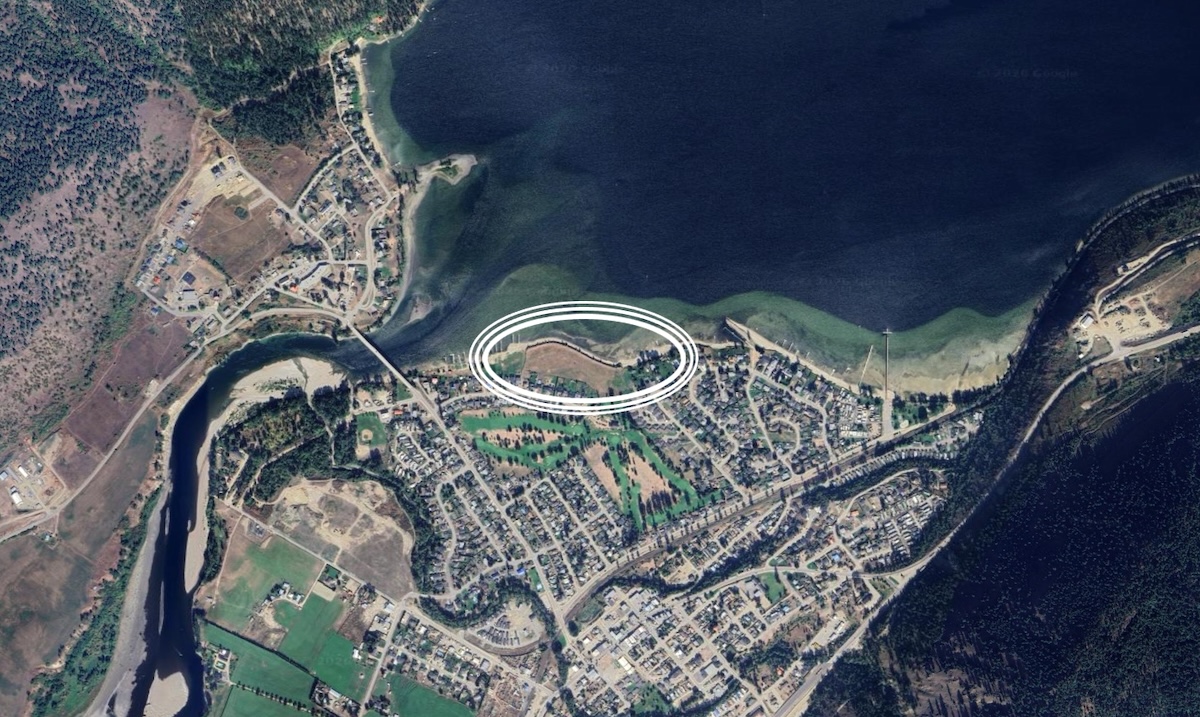 An aerial satellite image of a waterfront area circled in white.