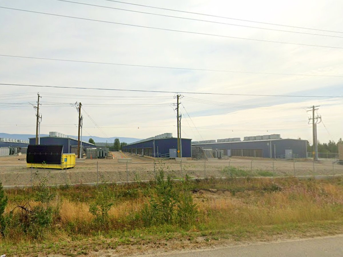 Long, narrow industrial buildings in a rural location.