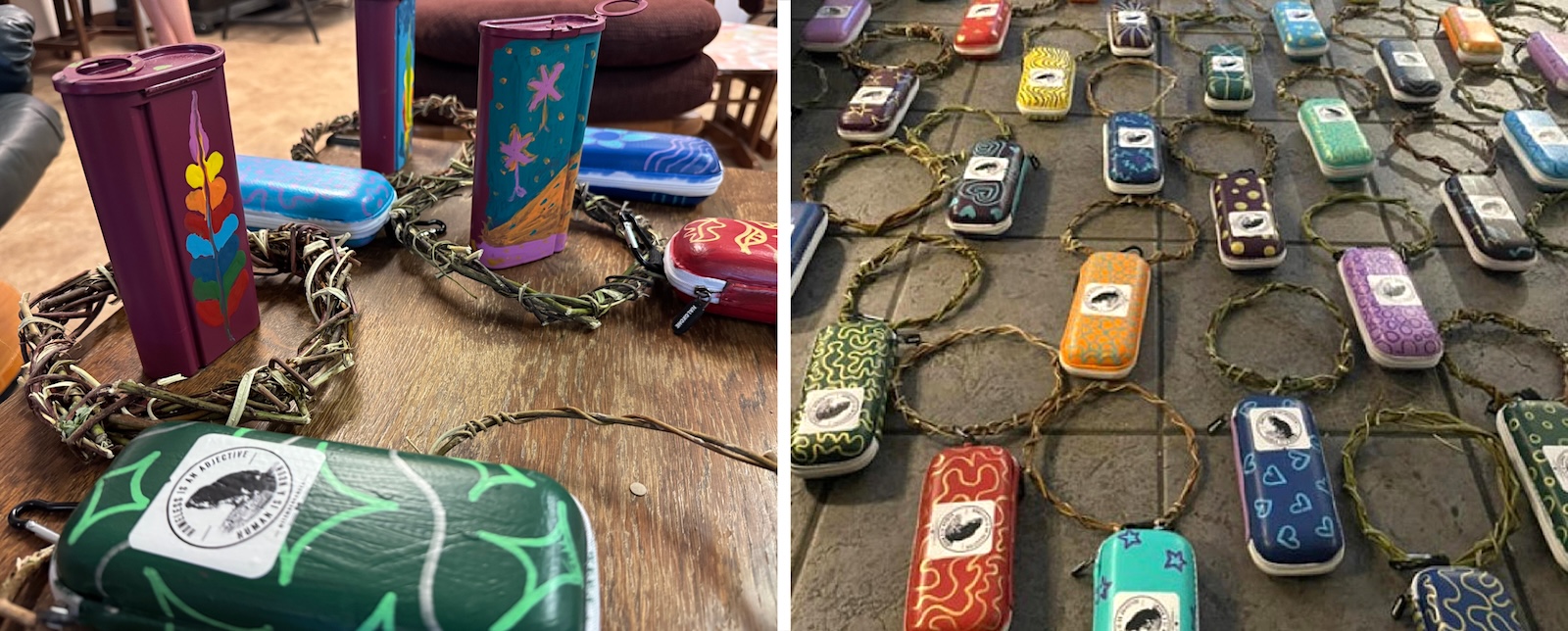 Brightly coloured plastic cases with willow loops attached to them are arranged on a table and on the ground.