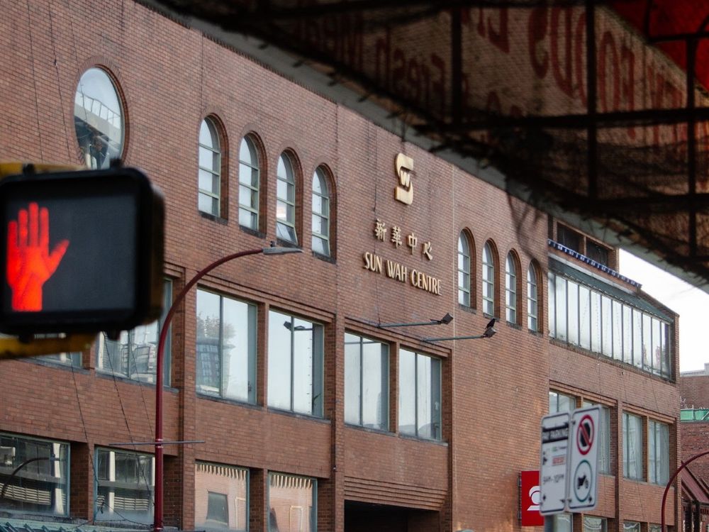 A brick building with lettering that reads Sun Wah Centre.
