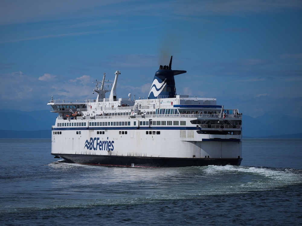 A BC Ferries boat sailing in the ocean.