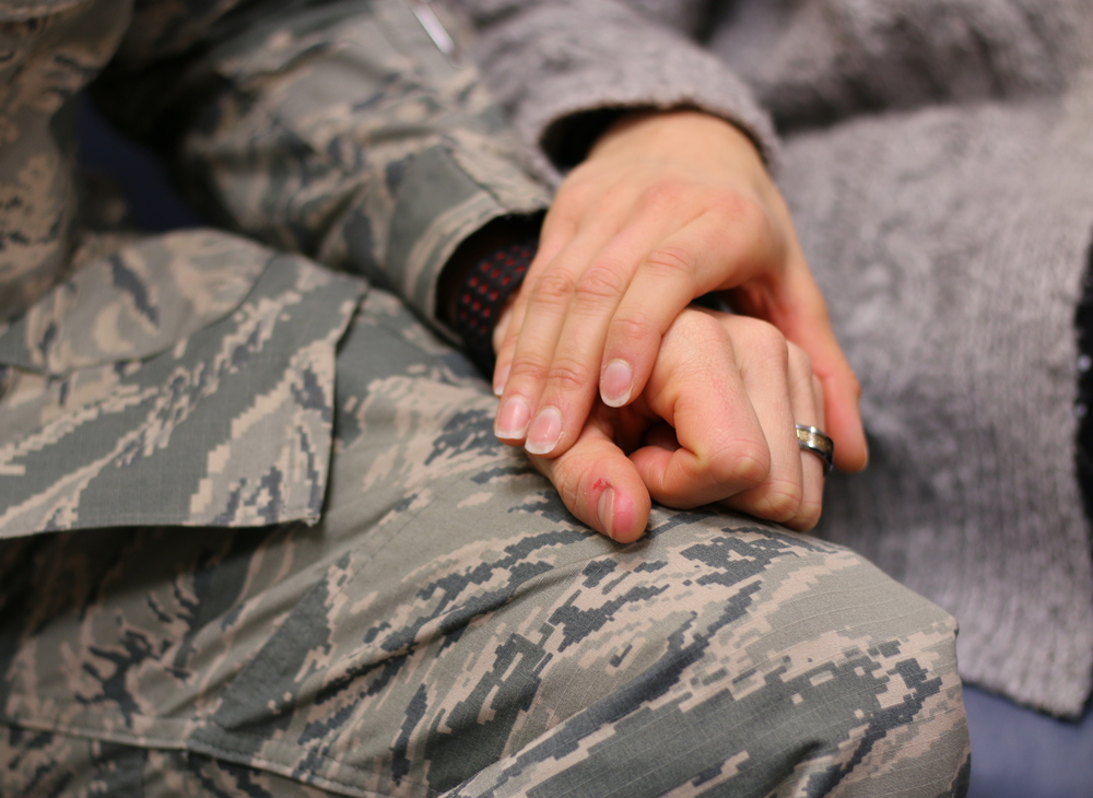 Soldier holding hands