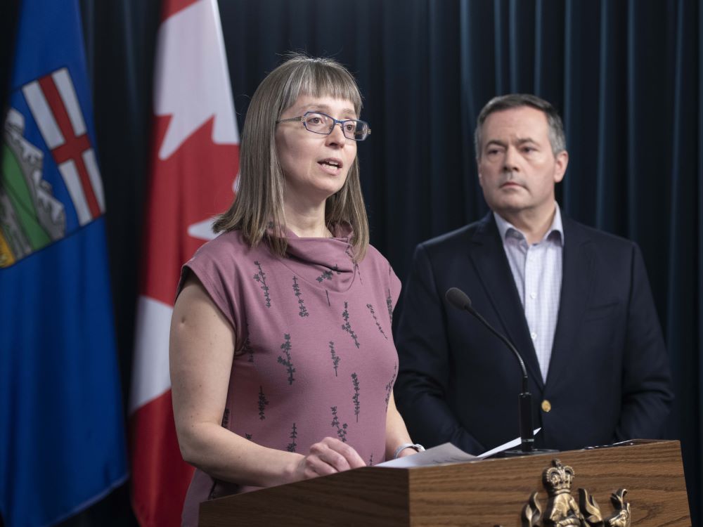 Former chief medical officer Dr. Deena Hinshaw, accompanied by Premier Jason Kenney, gives an update on COVID-19 in Alberta on March 15, 2020.