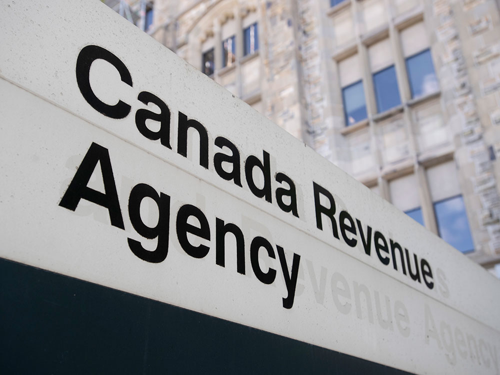A sign saying Canada Revenue Agency outside a building.