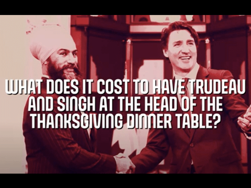 A tinted image shows NDP Leader Jagmeet  Singh and Prime Minister Justin Trudeau with “What Does It Cost To Have Trudeau and Singh At The Head Of The Thanksgiving Dinner Table” superimposed in white letters.