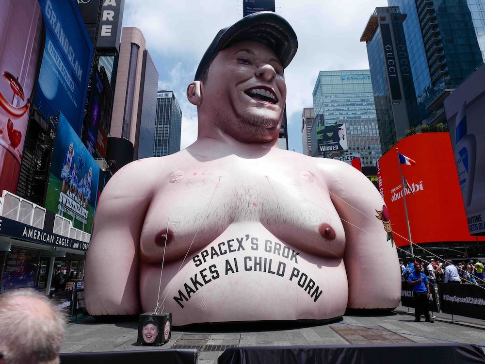 An 11-metre-tall inflatable statue of a naked, pale and pudgy Elon Musk in Times Square. On his chest is written &ldquo;Space-X&rsquo;s Grok makes child porn.&rdquo;