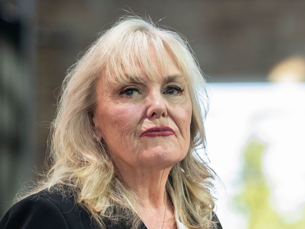 A close-up photo of a late middle-aged white woman, Kerry-Lynne Findlay, looking dour. 
