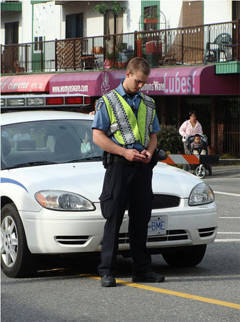 A policeman texting