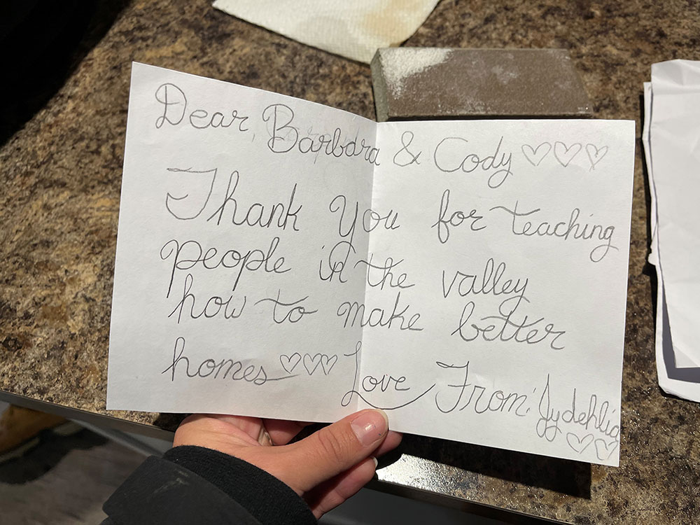 A handwritten note reads, “Dear Barbara and Cody, thank you for teaching people in the valley how to make better homes. Love from Jydehlia.” The note also features hand-drawn hearts.