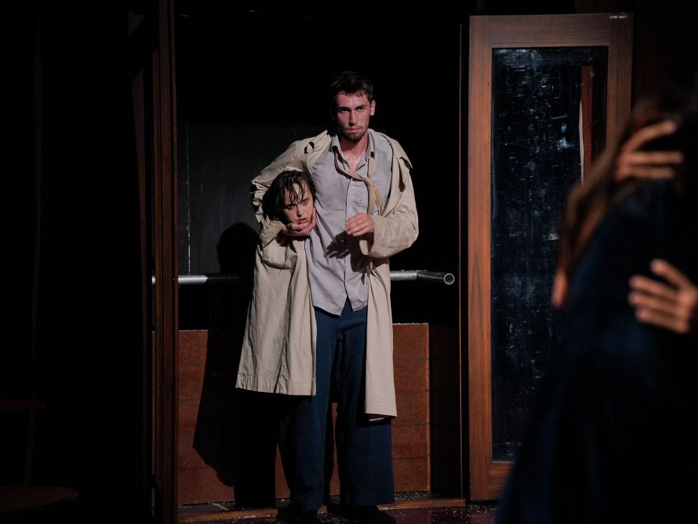 Dancers from Peeping Tom performing a contemporary dance with elements of film noir and dark comedy titled &ldquo;Diptych (The missing door and The lost room).&rdquo;