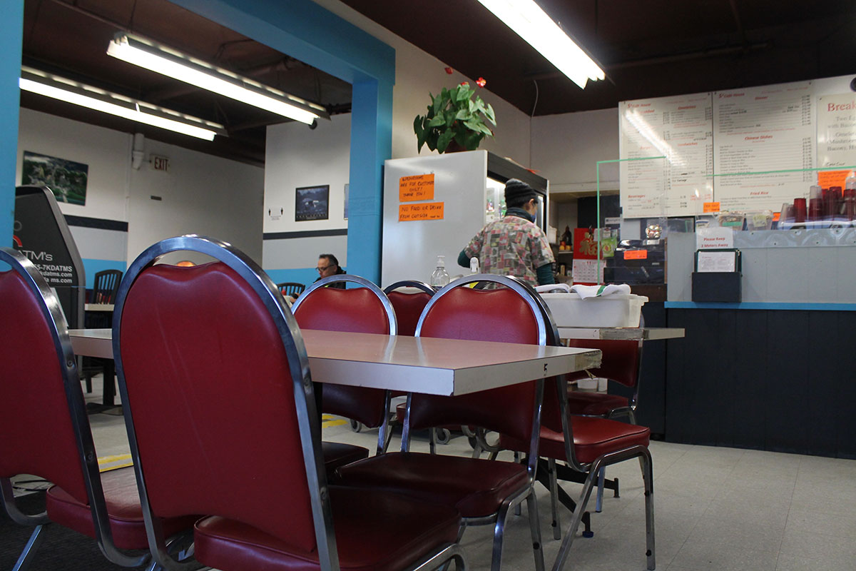 Red cushioned diner-style seats inside the S2 Cafe.