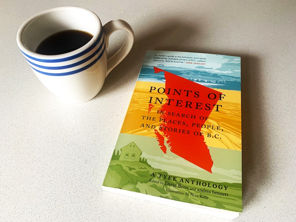 On a kitchen table: a blue and white coffee cup filled with coffee, sitting beside 'Points of Interest,' a book with a colourful cover.