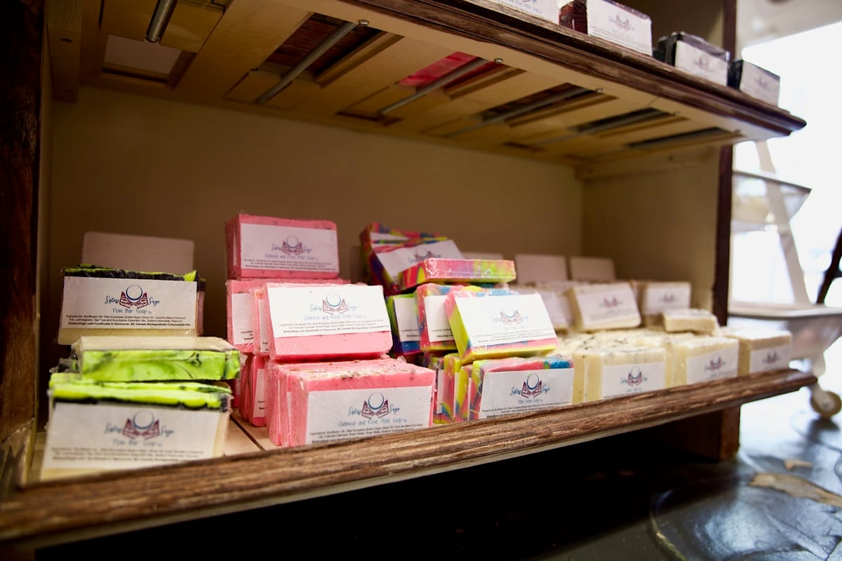 Packaged soap bars on shelves.