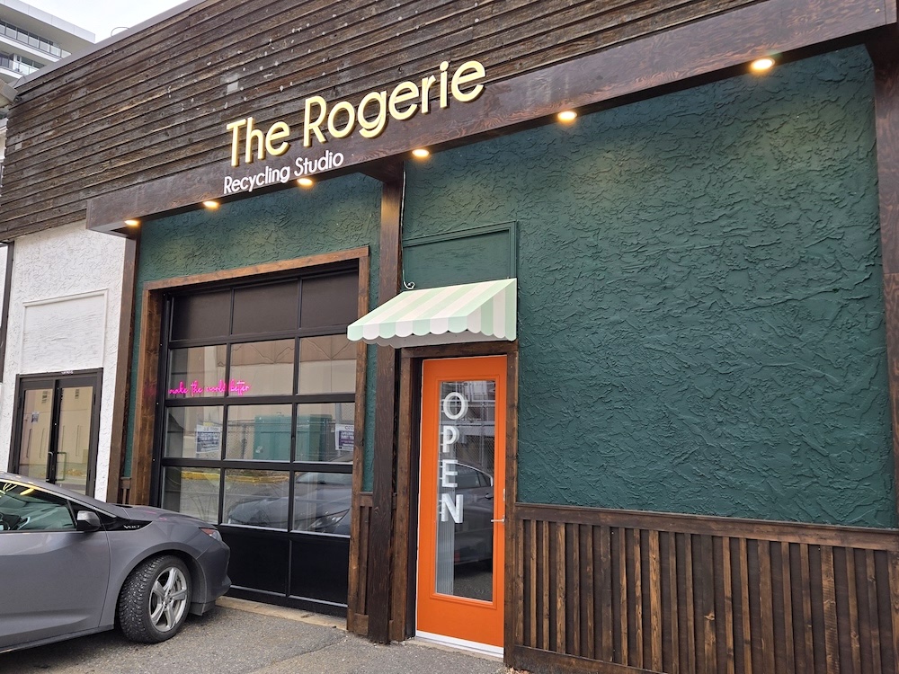 The green exterior of the building has the words 