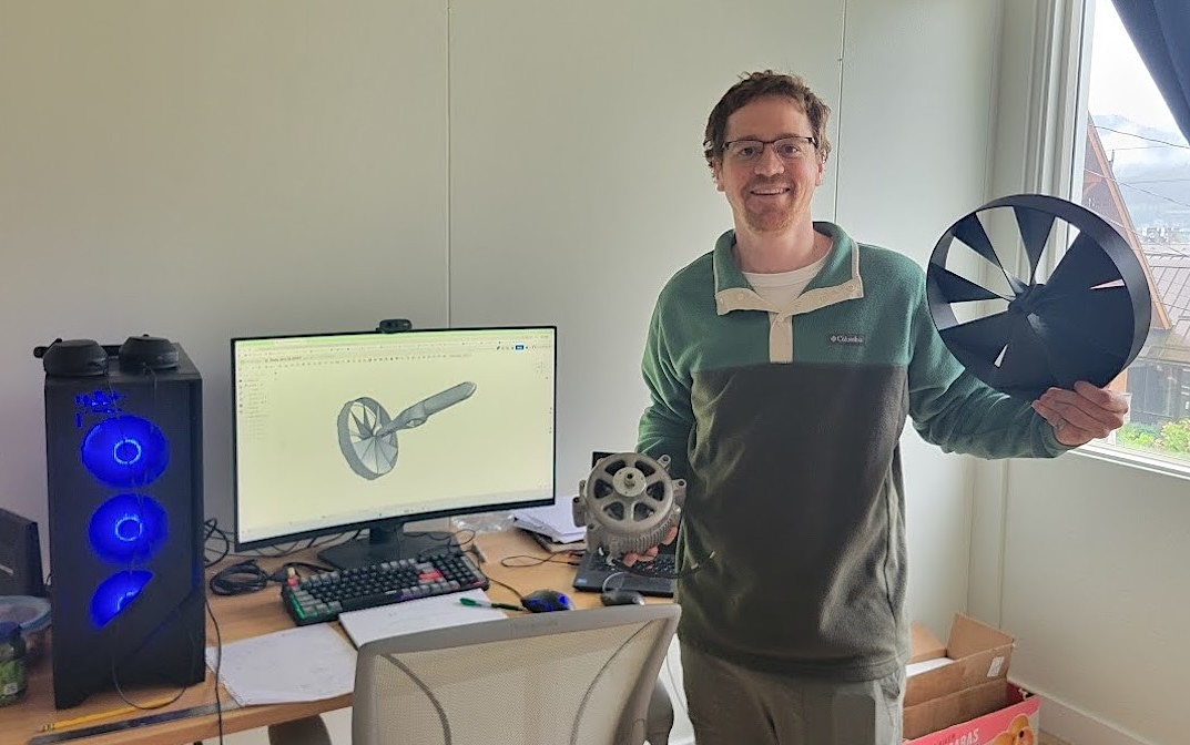 From his office in Juneau, Alaska, Lance McMullan shows off digital renderings of the Chinook 4.0, his company&rsquo;s most recent device. He holds the turbine in his left hand and another piece of the device in his right. 